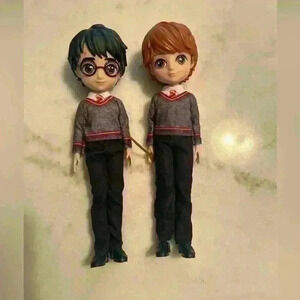 Harry Potter and Ron Weasley 8 inch action figures. Made by wizarding world.